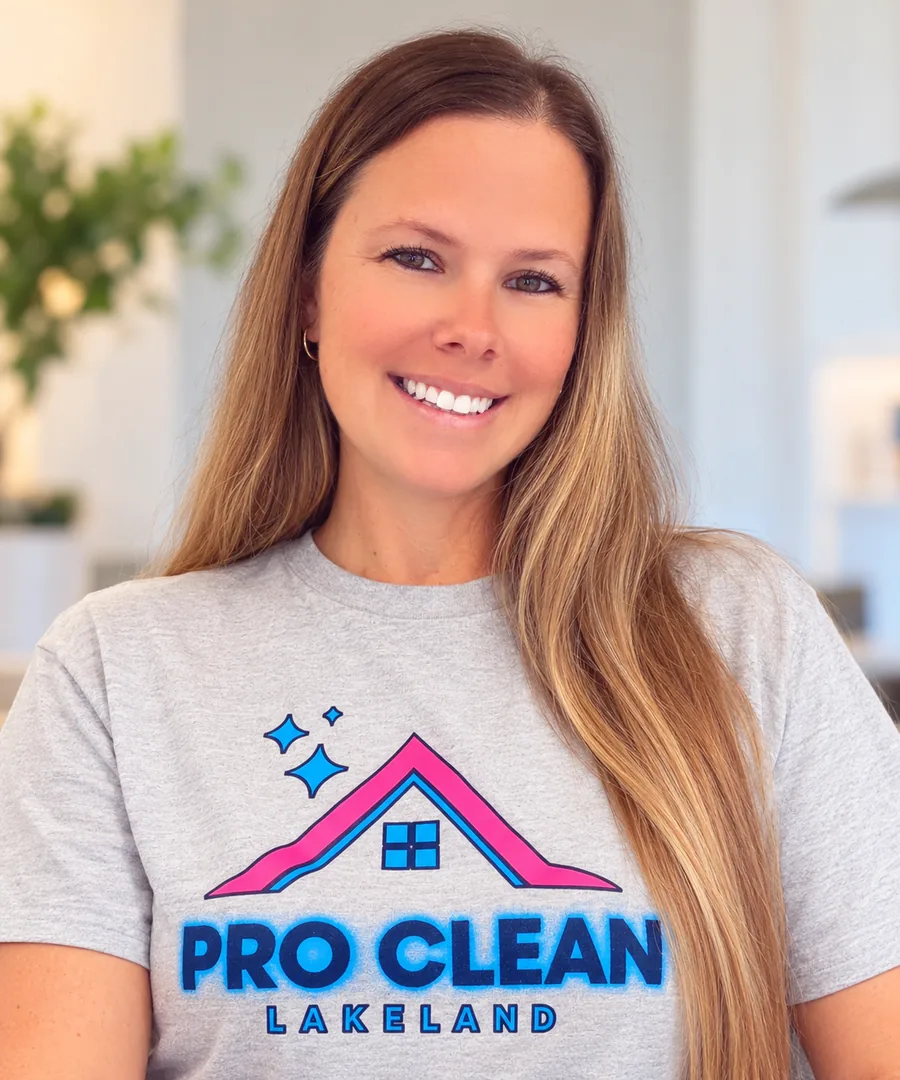 Trisha, owner of Pro Clean Lakeland, smiling in a Pro Clean Lakeland t-shirt